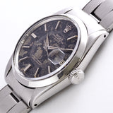 ROLEX OYSTER PERPETUAL DATE REF.1500 BLACK GILT PATINA DIAL