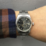 ROLEX OYSTER PERPETUAL DATE REF.1500 BLACK GILT PATINA DIAL
