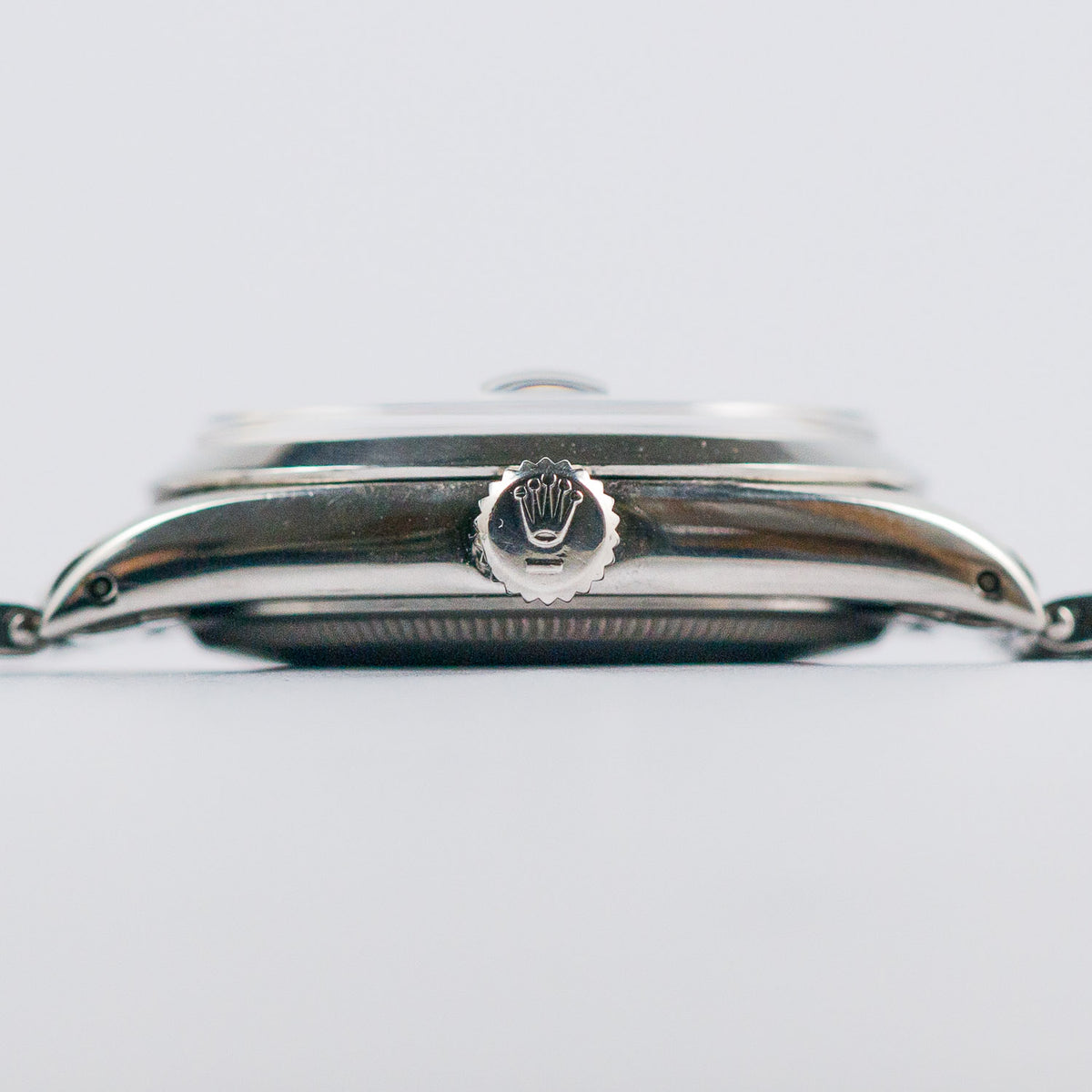 ROLEX OYSTER PERPETUAL DATE REF.1500 BLACK GILT PATINA DIAL