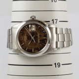 ROLEX OYSTER PERPETUAL DATE REF.1500 BLACK GILT PATINA DIAL