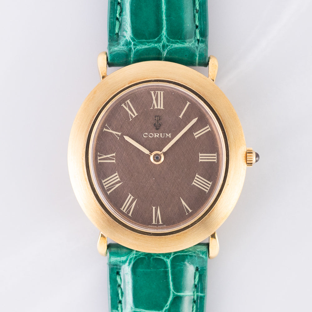 CORUM Ref.8781 Oval 18K Yellow Gold Brown Linen Dial