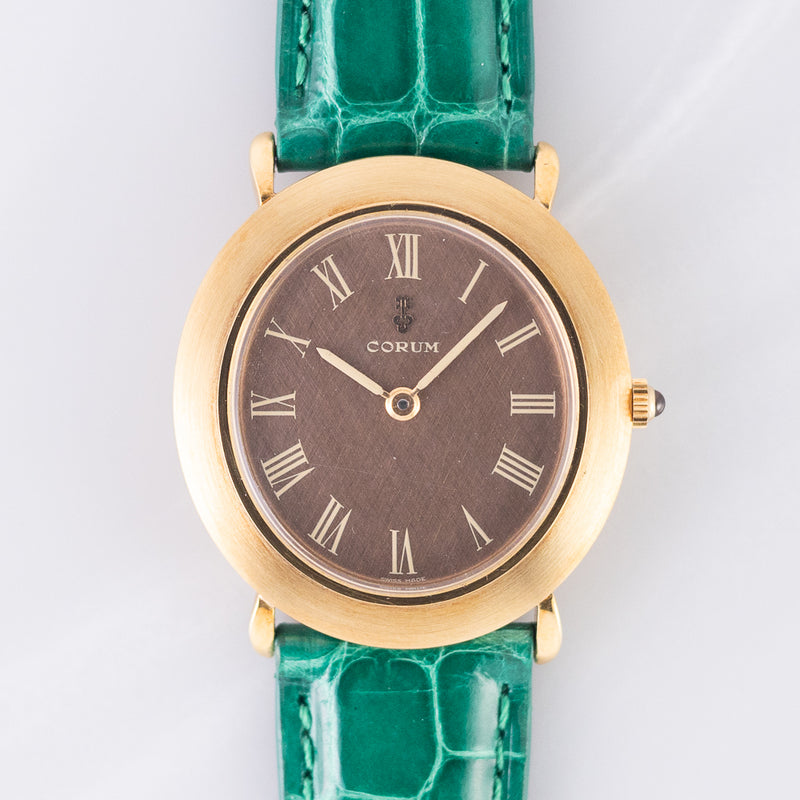 CORUM Ref.8781 Oval 18K Yellow Gold Brown Linen Dial