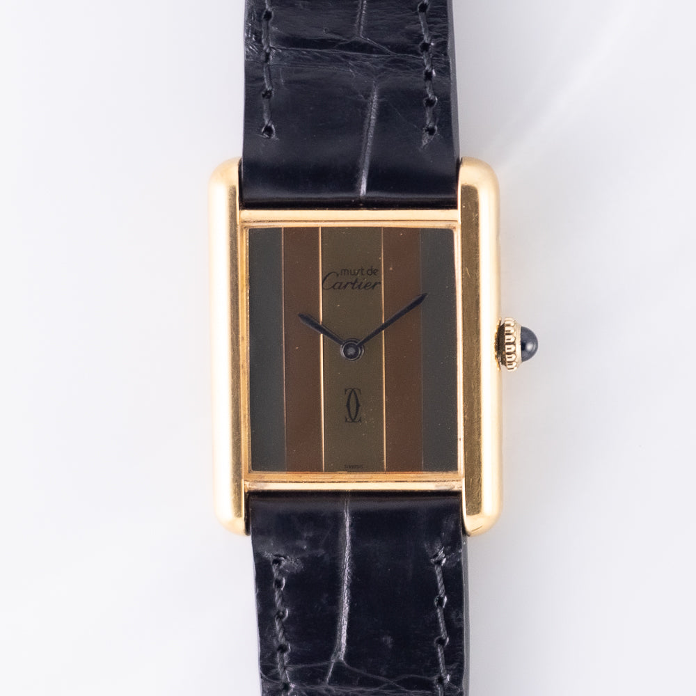 Large vermeil Must de Cartier Tank with the tricolour frame dial in concentric mirror-finished bands, blued hands and the signature with double-C logo. · Photo: Time Anagram · © Time Anagram, used with permission · Source: https://timeanagram.com/products/31215
