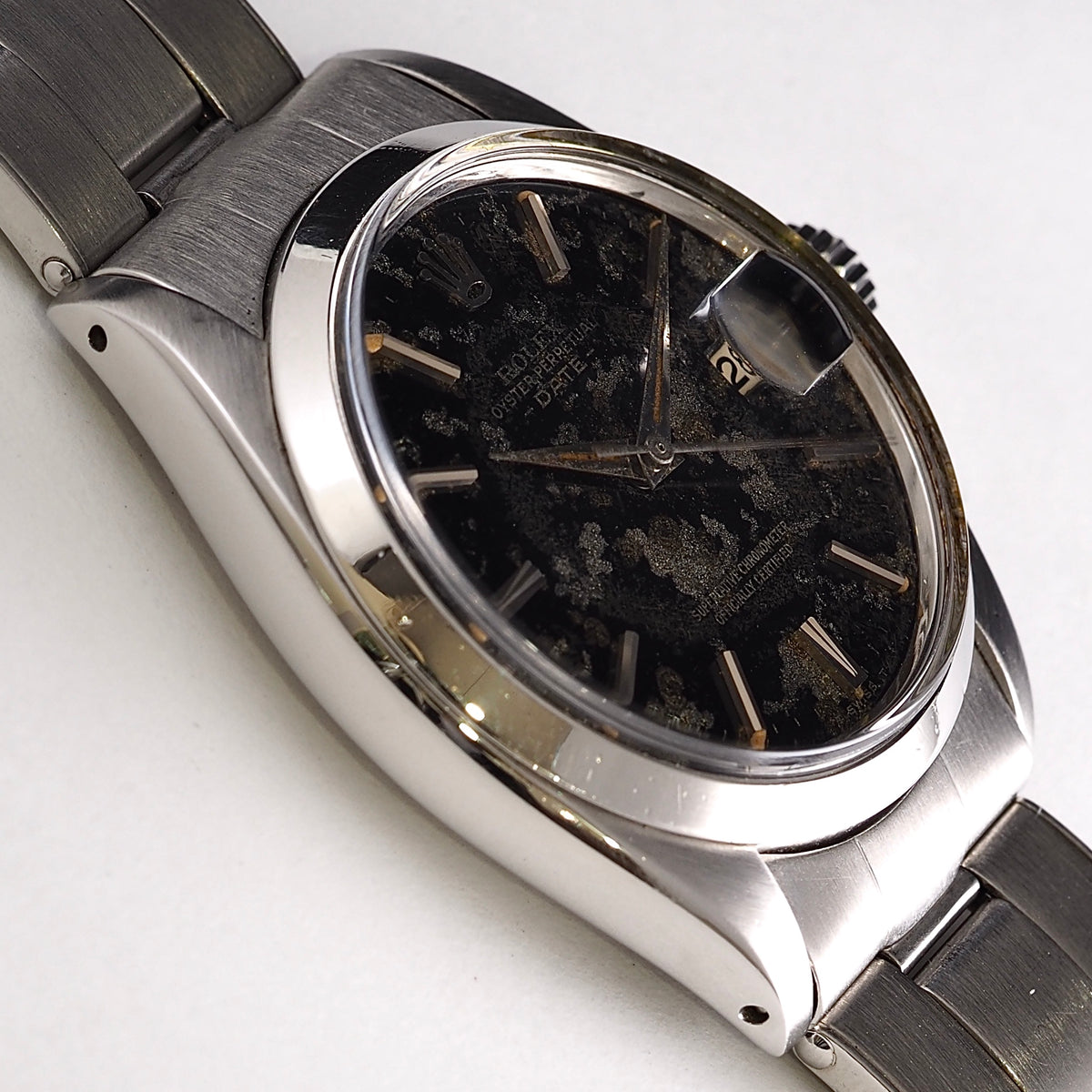 ROLEX OYSTER PERPETUAL DATE REF.1500 BLACK GILT PATINA DIAL