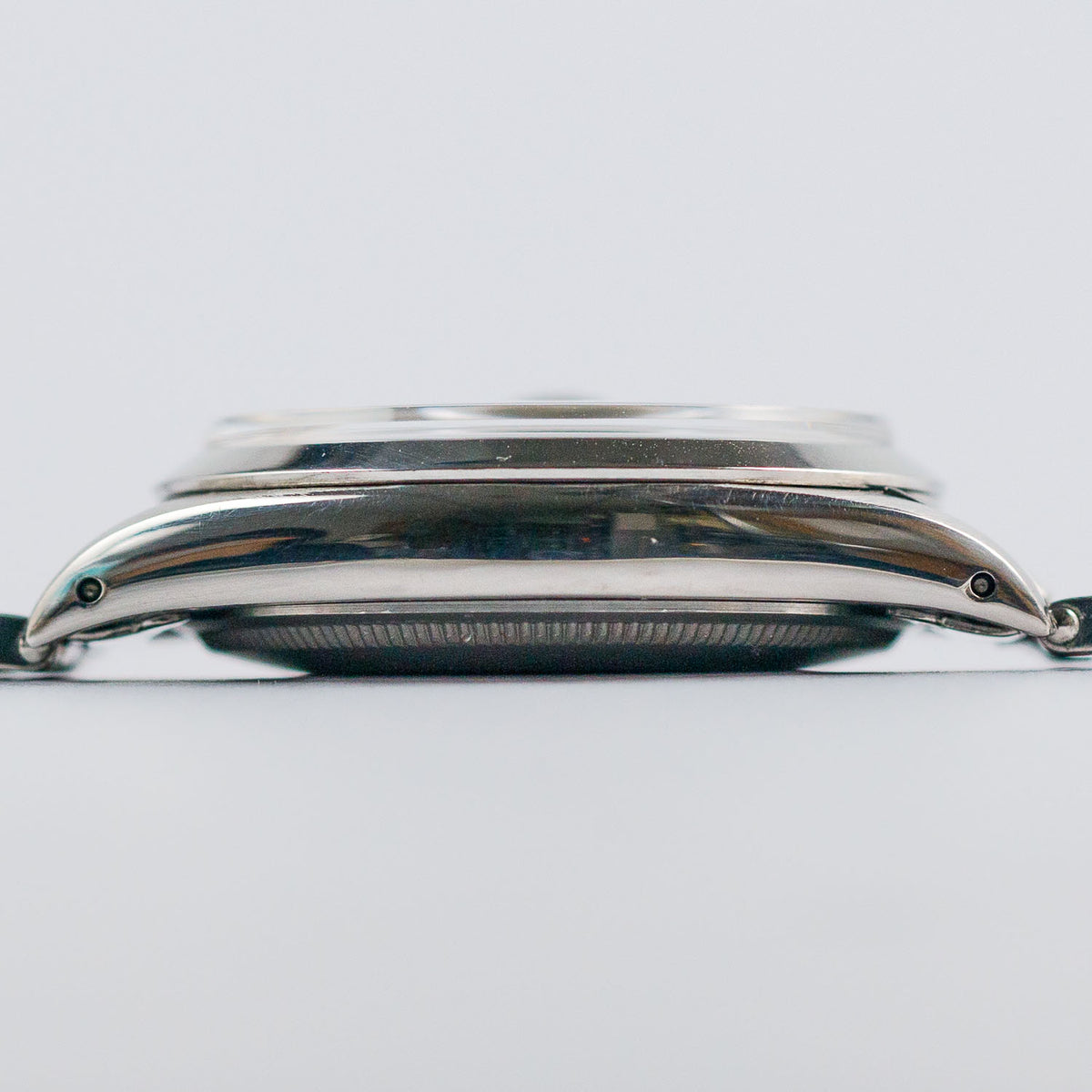ROLEX OYSTER PERPETUAL DATE REF.1500 BLACK GILT PATINA DIAL