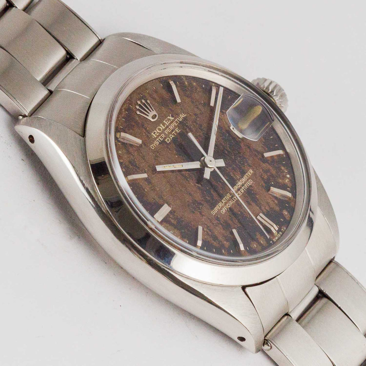 ROLEX OYSTER PERPETUAL DATE REF.1500 BLACK GILT PATINA DIAL