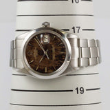 ROLEX OYSTER PERPETUAL DATE REF.1500 BLACK GILT PATINA DIAL