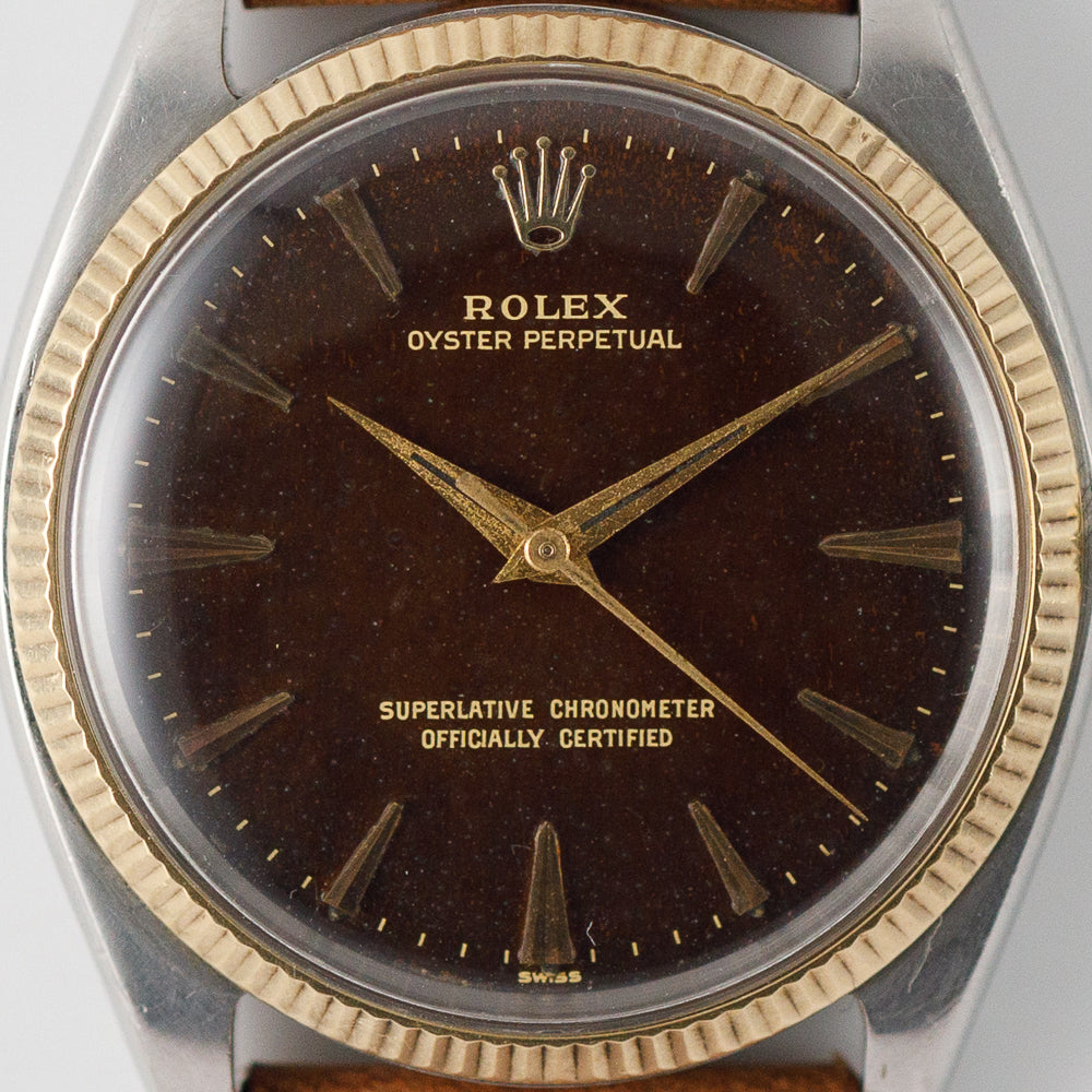 昭和を代表する一村哲也のオリジナルプリントです。ヴィンテージです ROLEX OYSTER PERPETUAL Ref.1005 Tropical Brown Dial – TIMEANAGRAM
