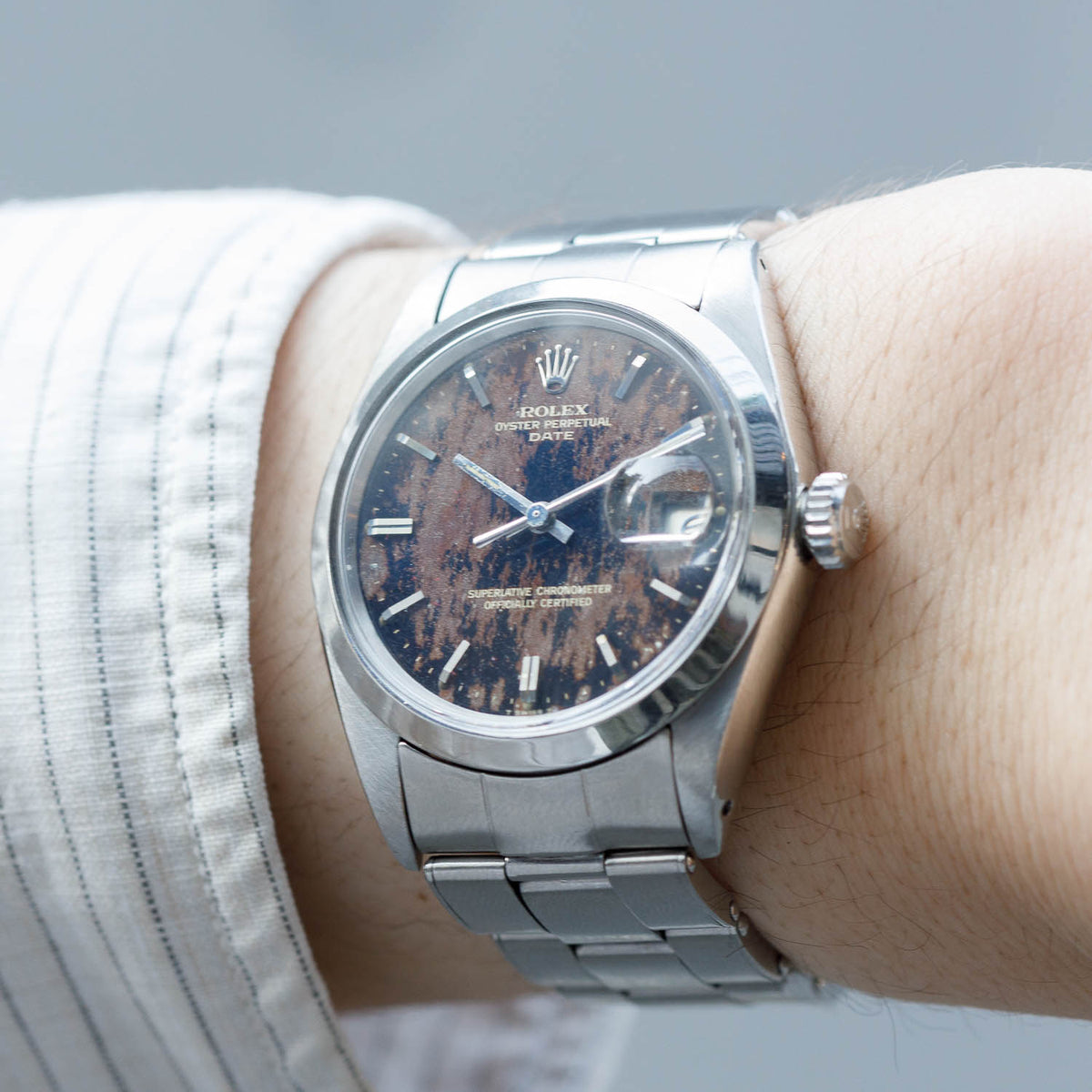 ROLEX OYSTER PERPETUAL DATE REF.1500 BLACK GILT PATINA DIAL