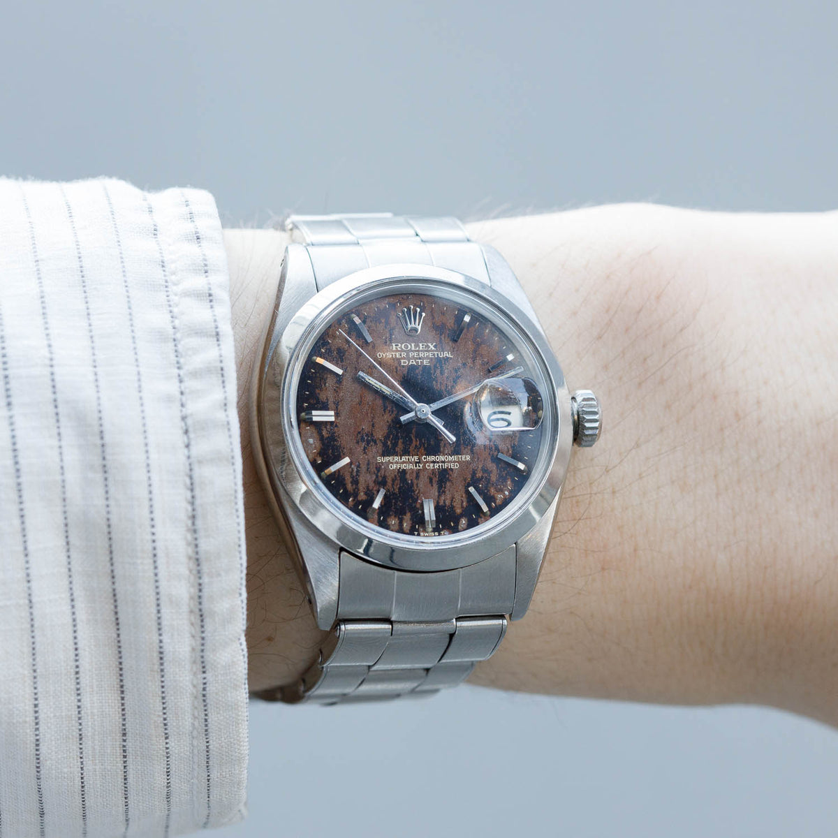 ROLEX OYSTER PERPETUAL DATE REF.1500 BLACK GILT PATINA DIAL